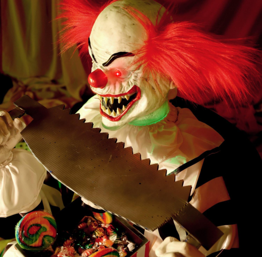 Clown mit Säge, sitzend