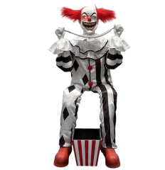 Clown mit Säge, sitzend